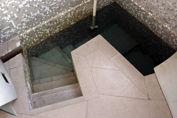 A contemporary mikveh. Mikveh is a special bath used for the purpose of ritual immersion in Judaism.