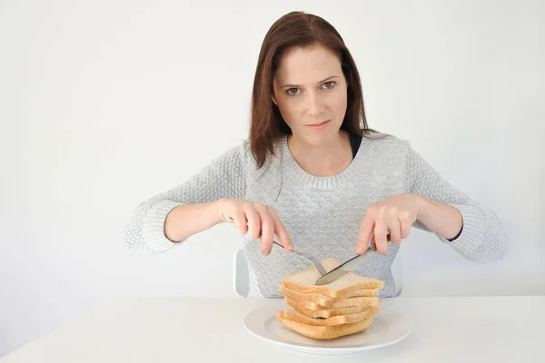 Young woman giving in to her urge and craving to Carbohydrates — Stock Photo, Image