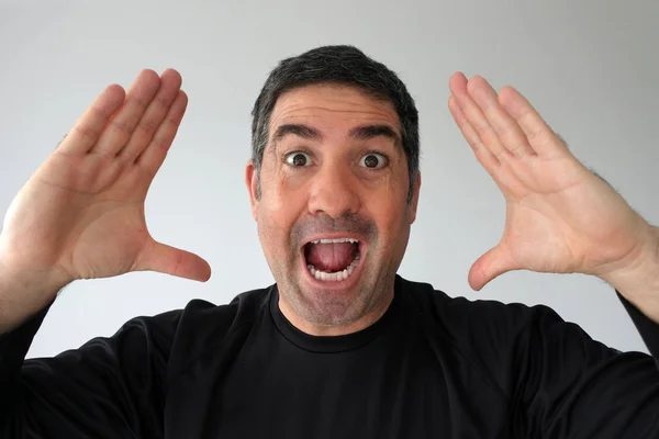 Surprised man  looks at the camera — Stock Photo, Image