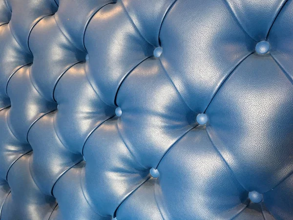 Blauwe lederen sofa achtergrond — Stockfoto