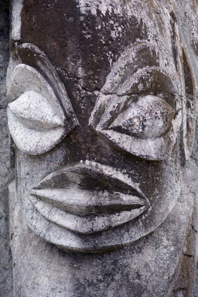 Polynesian male figurine rock carving in basalt sculpture