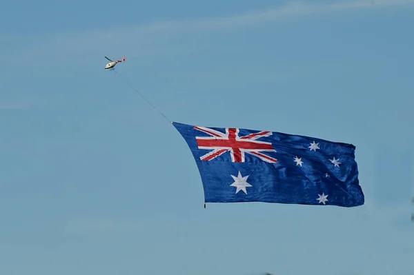 The national flag of Australia flying in the sk — Stock Photo, Image