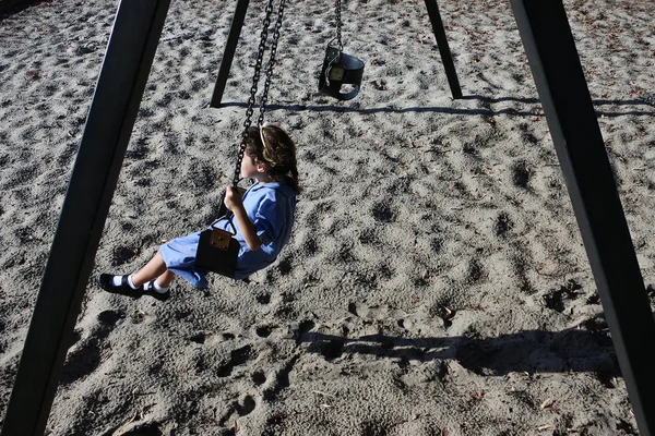 Young School Girl Age Wearing School Uniform Swinging Alone Swing — Stock Photo, Image