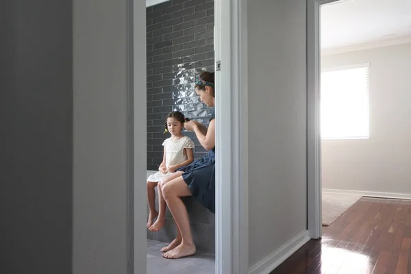 Mother Braiding Her Daughters Hair Bathroom Domestic Family Life Concept — Stock Photo, Image