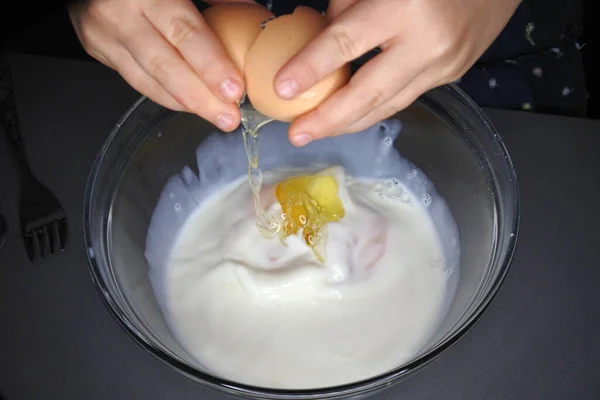 Person Hands Cracking Egg Bowl Full Milk — Stock Photo, Image
