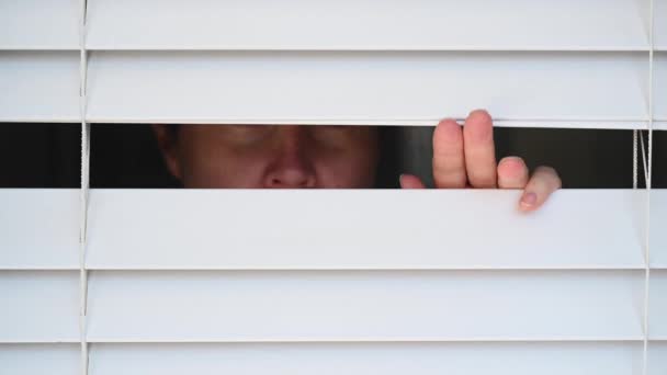 Suspicious Person Looking Home Window Venetian Curtains Concept Photo Person — Stock Video