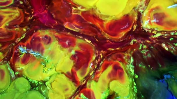 La peinture colorée liquide atténue le mélange au ralenti. Couleur liquide motifs de peinture texture vue du dessus. Surface de peinture liquide multicolore .