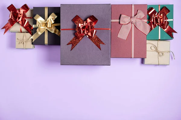 Christmas holiday composition. Various gift boxes on pastel purple background. Christmas, new year, birthday concept. Flat lay, top view, copy space — Stock Photo, Image