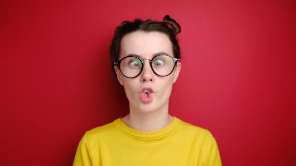 Comic Young Woman Glasses Makes Funny Face Crosses Eyes Plays — Stock Video