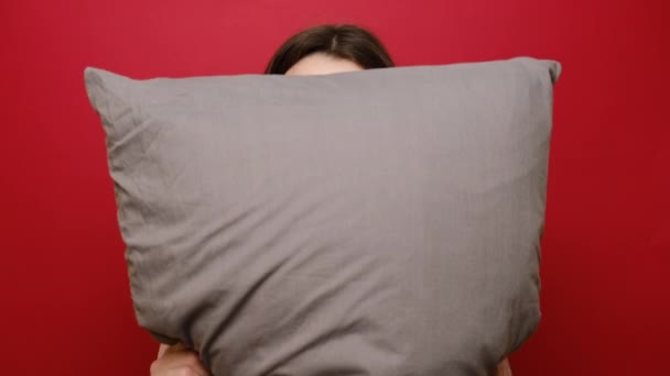 Portrait Playful Pleased Young Woman Embraces Grey Pillow Looks Mysteriously — Stock Video