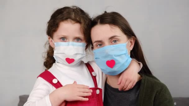 Portrait Young Family Sitting Bed Home Wearing Health Mask Heart — Stock Video