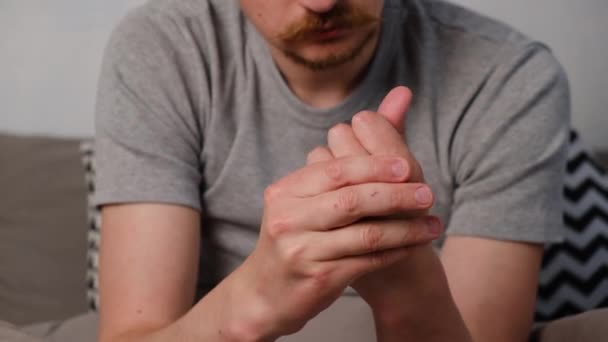 Tired Young Man Sitting Bed Massaging Hand Suffering Rheumatoid Arthritis — Stock Video