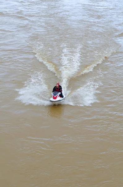 Men on a jet ski in a river. Aquatic rescue concept.