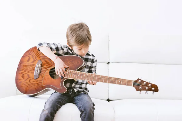 Young Man Playing Guitar Sitting Sofa White Background Copy Space — Stock Photo, Image