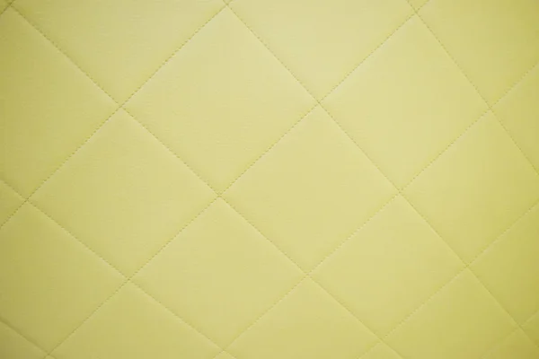 Oberfläche aus gelbem Kunstleder für Hintergrund und leere s — Stockfoto