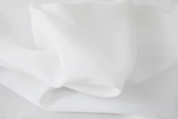 Tecido branco tem uma ondulação suave . — Fotografia de Stock