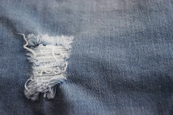 Denim yüzey, gözyaşı ve kadar fiber kot pantolon. 