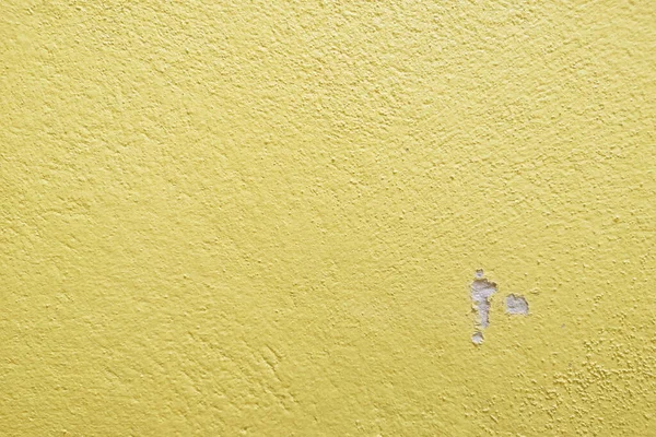 Eran grietas tono cálido amarillo cemento pared fondo limpio estilo vintage y espacio vacío para el texto . — Foto de Stock