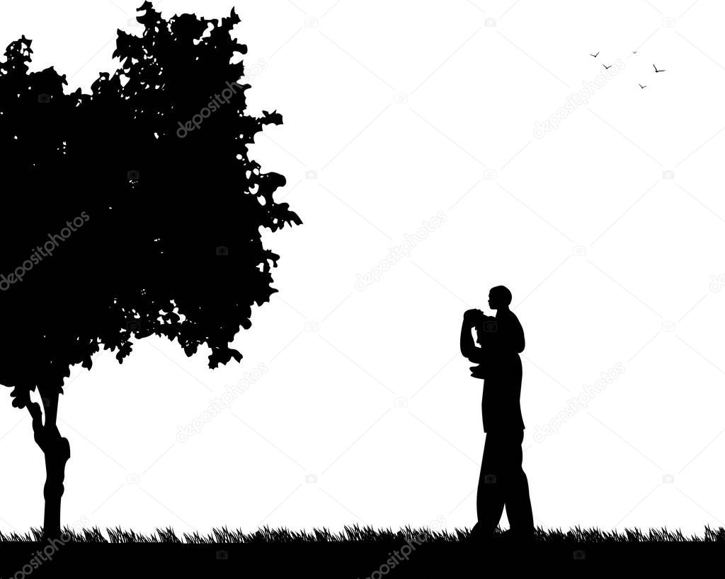 Father carrying a child on his shoulders in the park