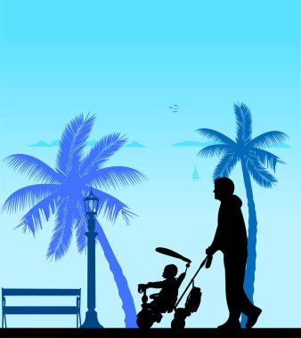 Onun bebek ile bir üç tekerlekli bisiklet Sahilde yürürken baba