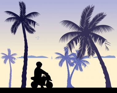 Çocuk sahilde bir motosiklet oyuncak sürmek