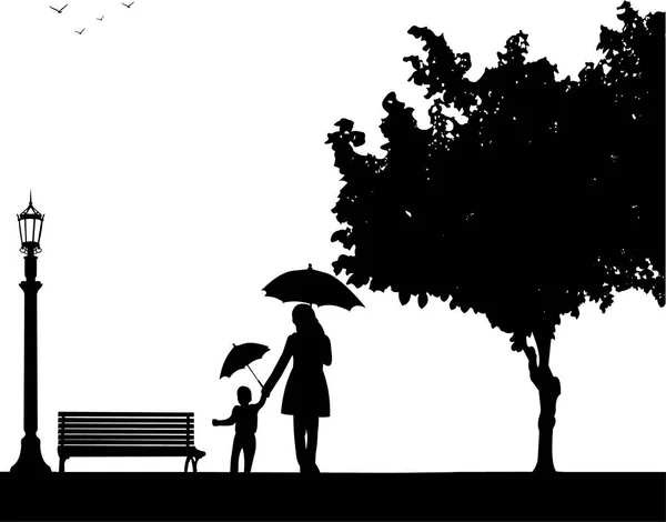 Mor gå med sitt barn i parken med paraplyer — Stock vektor