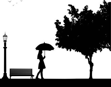 Park şemsiyesi altında yürüyen genç kadın