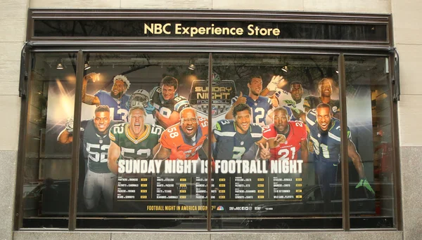 NBC Experience Store window display decorated with NBC and Sunday night Football logos in Rockefeller Center — Stock Photo, Image