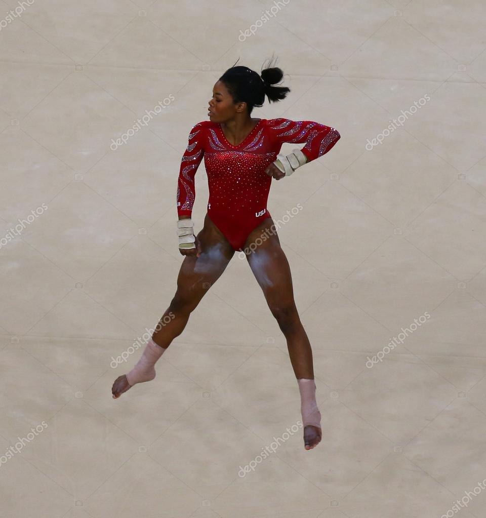 RIO DE JANEIRO, BRAZIL - AUGUST 4, 2016: Olympic champion Gabby Douglas of United States during an artistic gymnastics floor exercise training session for Rio 2016 Olympics at the Rio Olympic Arena
