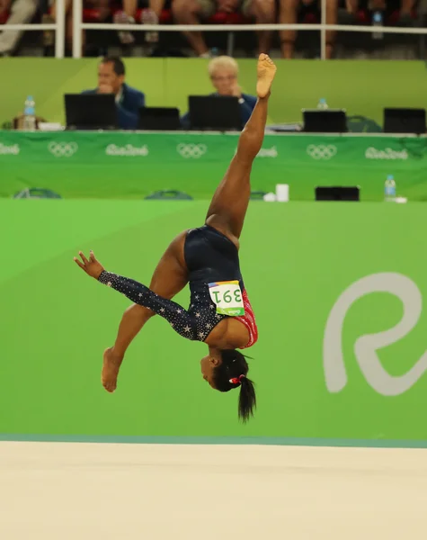 Olympic champion Simone Biles of United States competes on the floor exercise during women's all-around gymnastics qualification — ストック写真