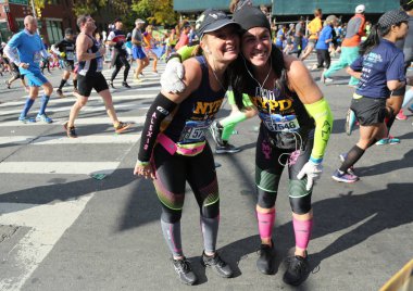 New York City Marathon runners traverse 26.2 miles through all five NYC boroughs to the finish line in Central Park, Manhattan clipart