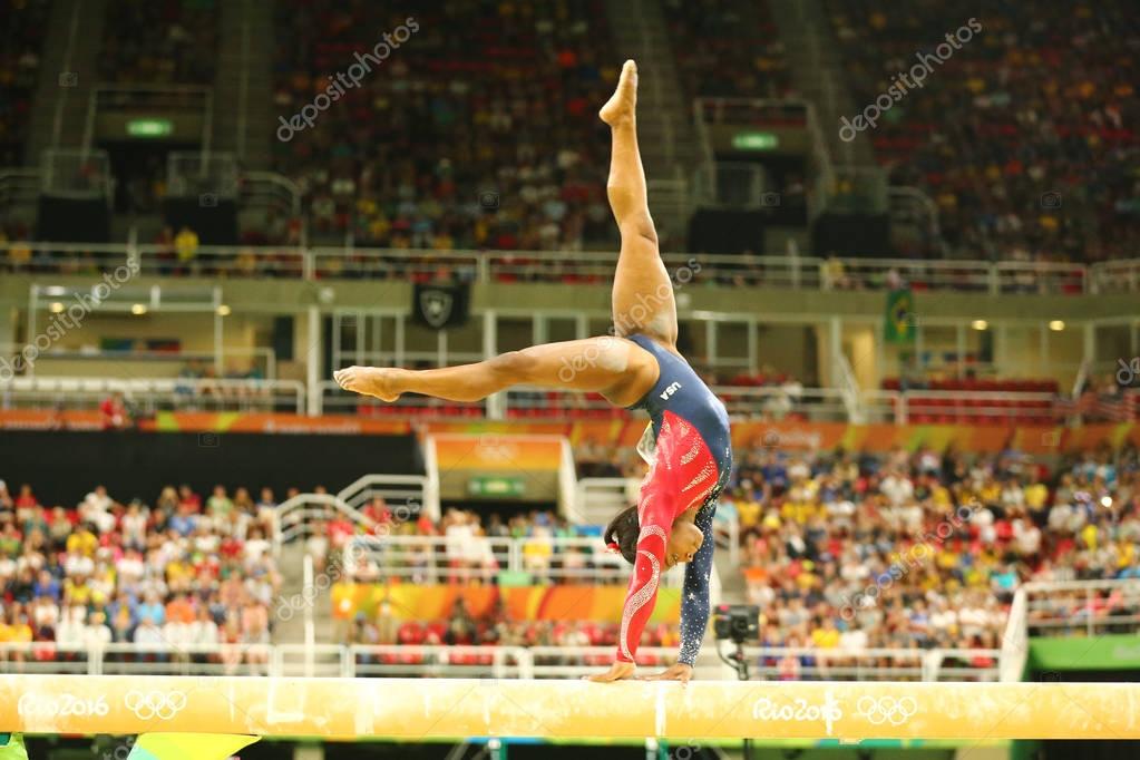 RIO DE JANEIRO, BRAZIL AUGUST 7, 2016: Olympic champion Simone Biles of United States competing on the balance beam at women's all-around gymnastics qualification at Rio 2016 Olympic Games