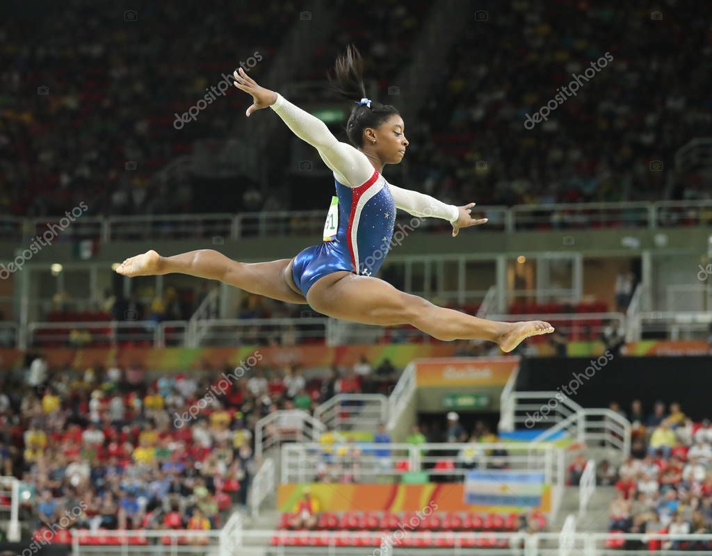RIO DE JANEIRO, BRAZIL - AUGUST 11, 2016: Olympic champion Simone Biles of United States competing on the balance beam at women's all-around gymnastics at Rio 2016 Olympic Games