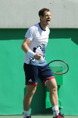Olympic champion Andy Murray of Great Britain celebrates victory after men's singles semifinal of the Rio 2016 Olympic Games clipart
