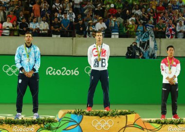 Juan Martin Del Porto ARG (L), Olympic champion Andy Murray GBR and Kei Nishikori JPN during tennis men's singles medal ceremony of the Rio 2016 Olympic Games  clipart