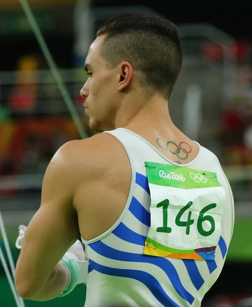 Olympic champion Eleftherios Petrounias of Greece competes at the Men's Rings Final on artistic gymnastics competition at Rio 2016 Olympic Games — Stock Photo, Image