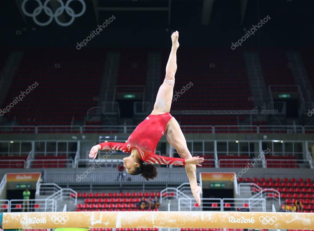 RIO DE JANEIRO, BRAZIL - AUGUST 4, 2016: Olympic champion Laurie Hernandez of United States practices on the balance beam before women's all-around gymnastics at Rio 2016 Olympic Games