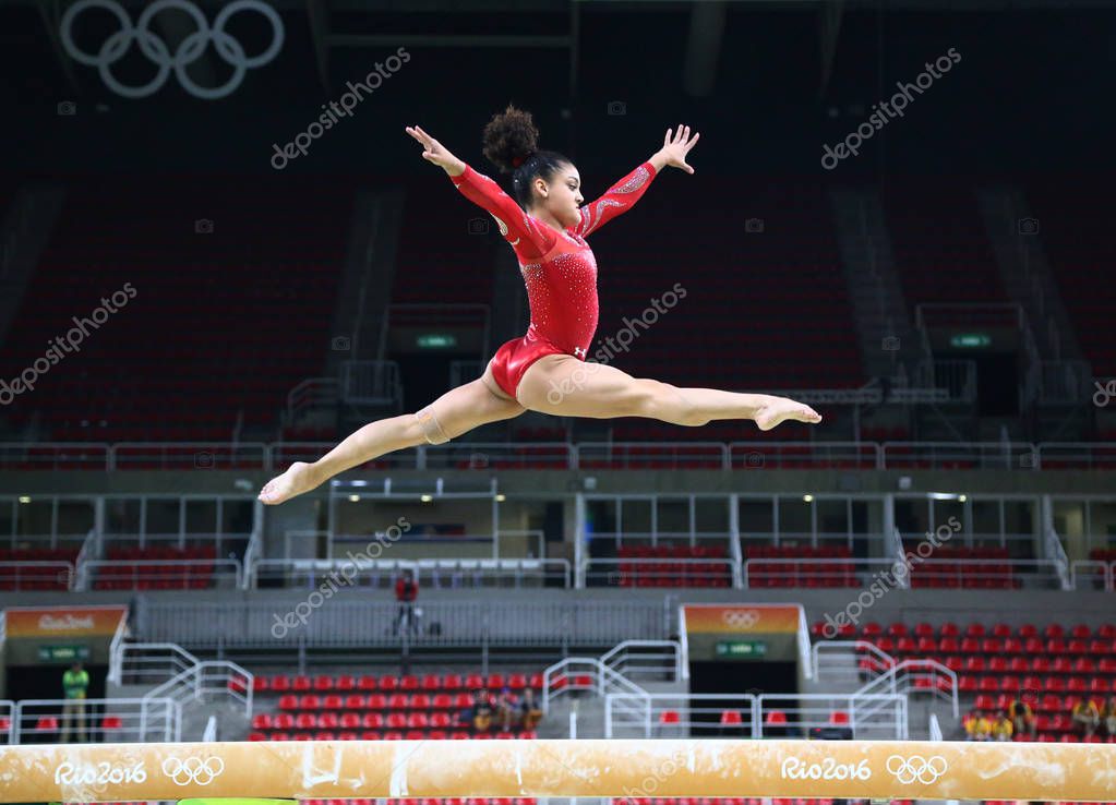RIO DE JANEIRO, BRAZIL - AUGUST 4, 2016: Olympic champion Laurie Hernandez of United States practices on the balance beam before women's all-around gymnastics at Rio 2016 Olympic Games