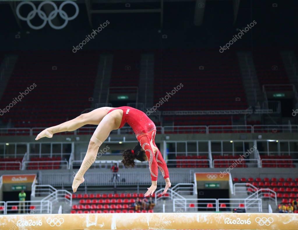 RIO DE JANEIRO, BRAZIL - AUGUST 4, 2016: Olympic champion Laurie Hernandez of United States practices on the balance beam before women's all-around gymnastics at Rio 2016 Olympic Games