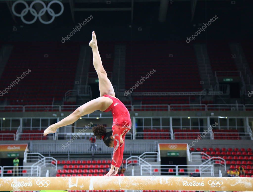 RIO DE JANEIRO, BRAZIL - AUGUST 4, 2016: Olympic champion Laurie Hernandez of United States practices on the balance beam before women's all-around gymnastics at Rio 2016 Olympic Games