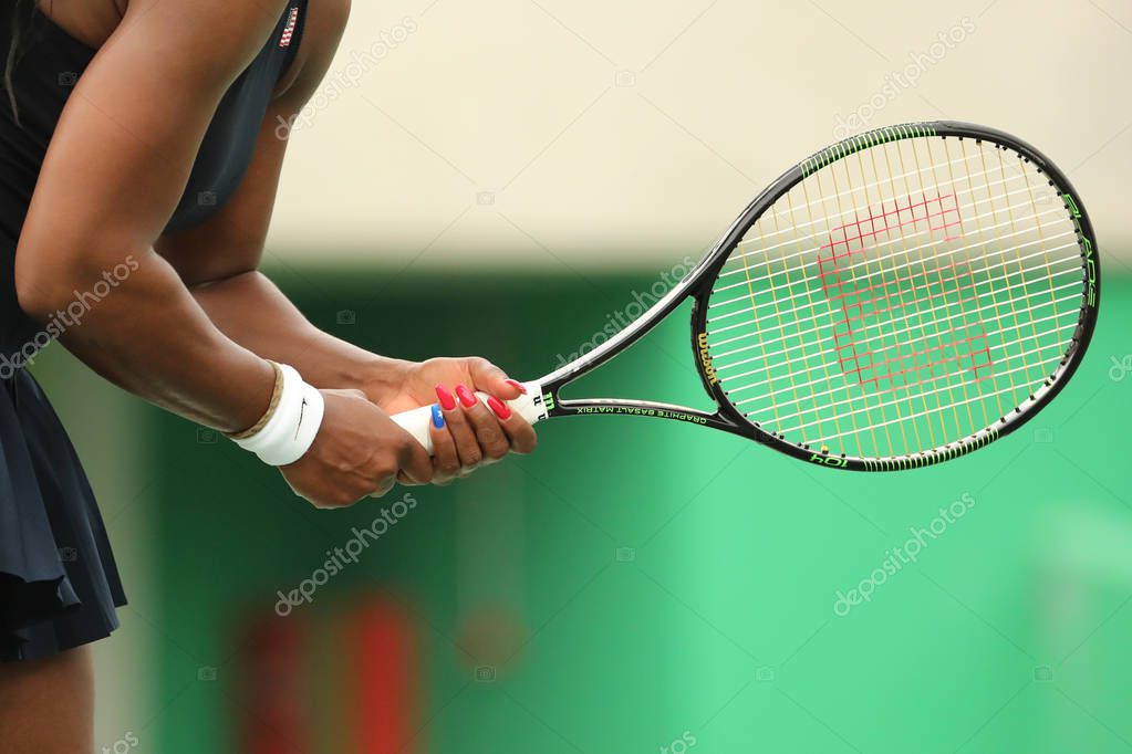 RIO DE JANEIRO, BRAZIL - AUGUST 7, 2016: Olympic champion Serena Williams of United States plays with Wilson racquet during first round match of the Rio 2016 Olympic Games at the Olympic Tennis Centre