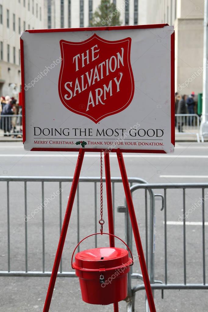 NEW YORK - DECEMBER 15, 2016: Salvation Army red kettle for collections in midtown Manhattan. This Christian organization is known for its charity work, operating in 126 countries