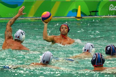 Tony Azevedo of Water Polo Team USA competes in the men's water polo group match between the United States and France clipart