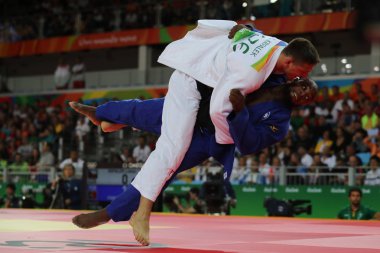 Olympic champion Czech Republic Judoka Lukas Krpalek (in white) in action against Jorge Fonseca of Portugal during men -100 kg match of the Rio 2016 Olympics clipart