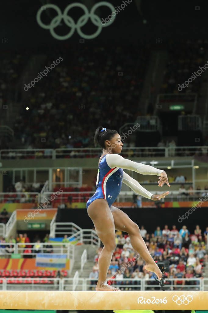RIO DE JANEIRO, BRAZIL - AUGUST 11, 2016: Olympic champion Simone Biles of United States competes on the balance beam at women's all-around gymnastics at Rio 2016 Olympic Games
