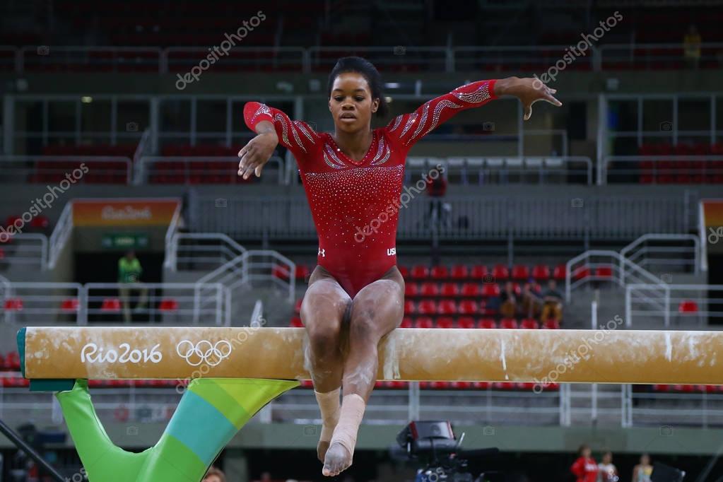 RIO DE JANEIRO, BRAZIL AUGUST 4, 2016: Olympic champion Gabby Douglas  of United States practices on the balance beam before women's all-around gymnastics at Rio 2016 Olympic Games
