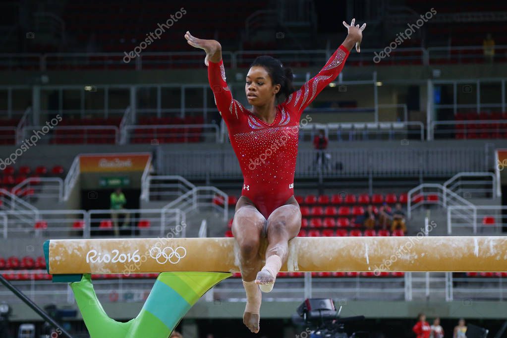 RIO DE JANEIRO, BRAZIL AUGUST 4, 2016: Olympic champion Gabby Douglas  of United States practices on the balance beam before women's all-around gymnastics at Rio 2016 Olympic Games