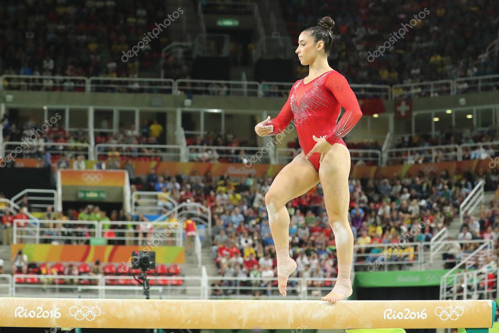 RIO DE JANEIRO, BRAZIL - AUGUST 11, 2016: Olympic champion Aly Raisman of United States competing on the balance beam at women's all-around gymnastics at Rio 2016 Olympic Games