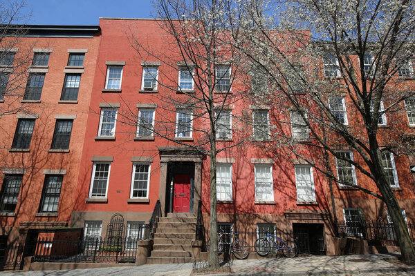 BROOKLYN, NEW YORK - APRIL 11, 2017: New York City brownstones at historic Brooklyn Heights neighborhood. Brooklyn Heights is an affluent residential neighborhood within the New York City borough of Brooklyn