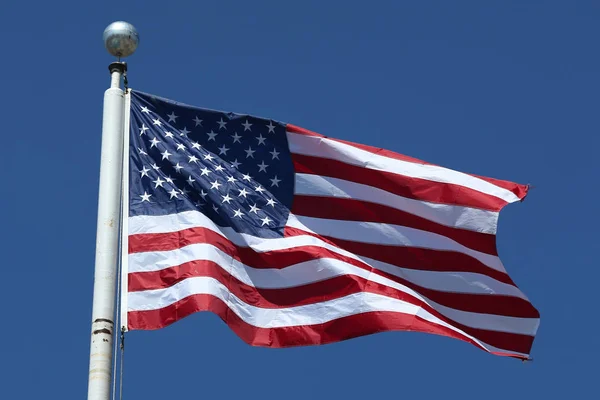 American flag flying high — Stock Photo, Image